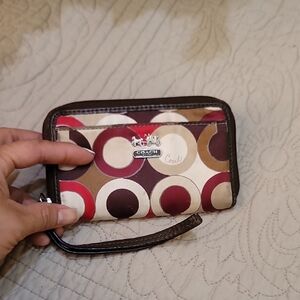Coach Circle Pattern Wristlet in Red, Brown, and Cream